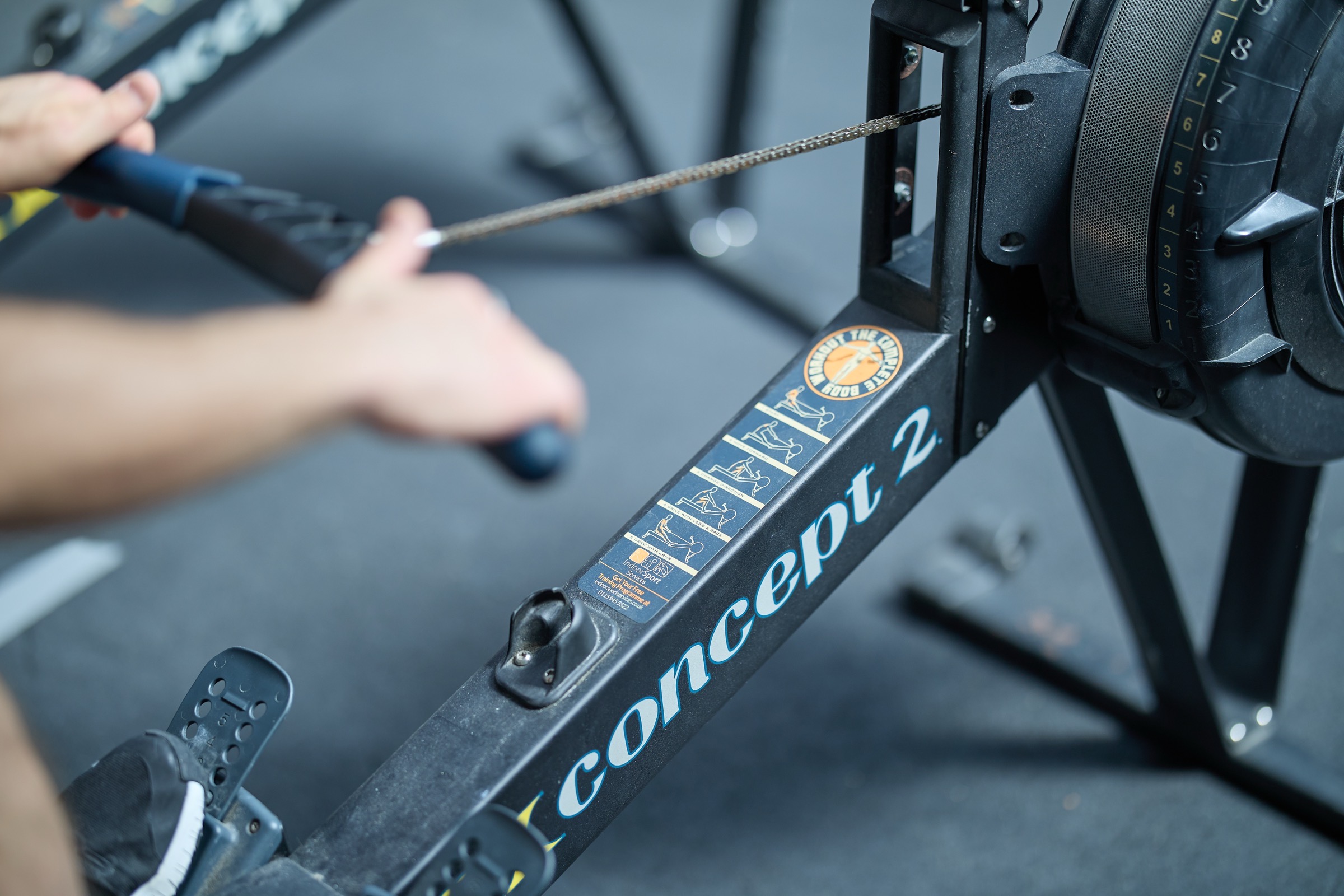 Close-up of the handle and chain under load mid-stroke
