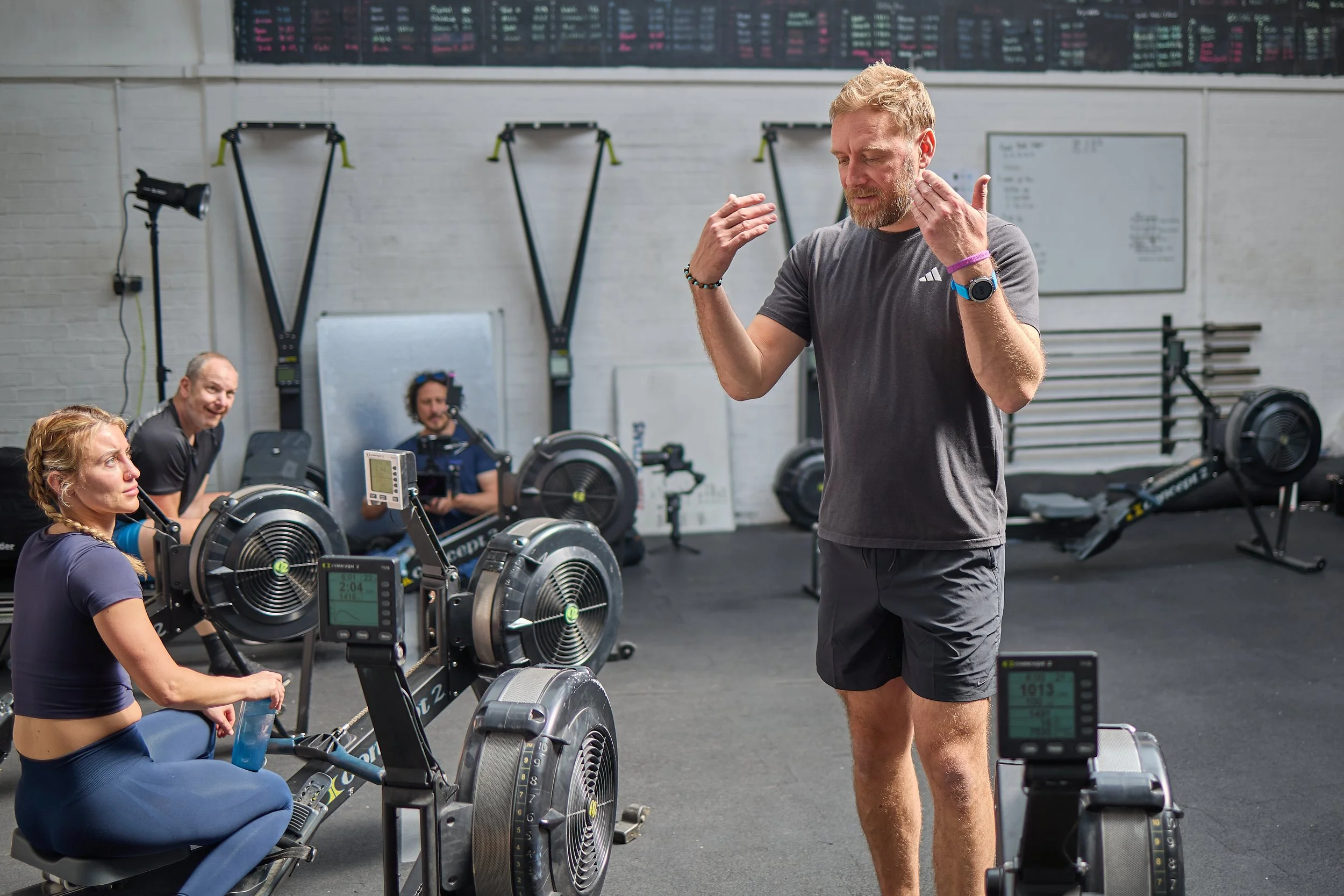 Rob Mayes explaining rowing technique to a client